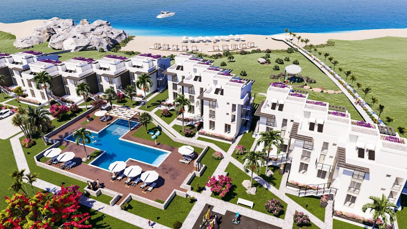 LOFT FLAT FOR SALE FROM A PROJECT WITH A PRIVATE BEACH IN GIRNE KÜÇÜKERENKÖY AREA